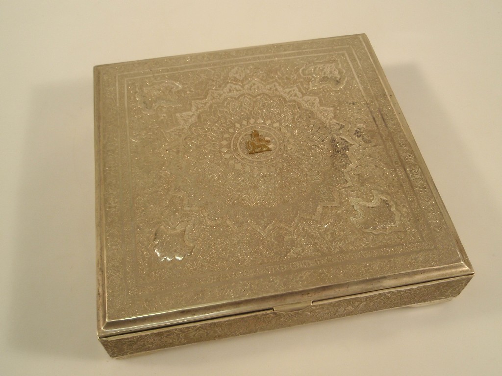 Appraisal: An Iranian silver square box and cover embossed and chased