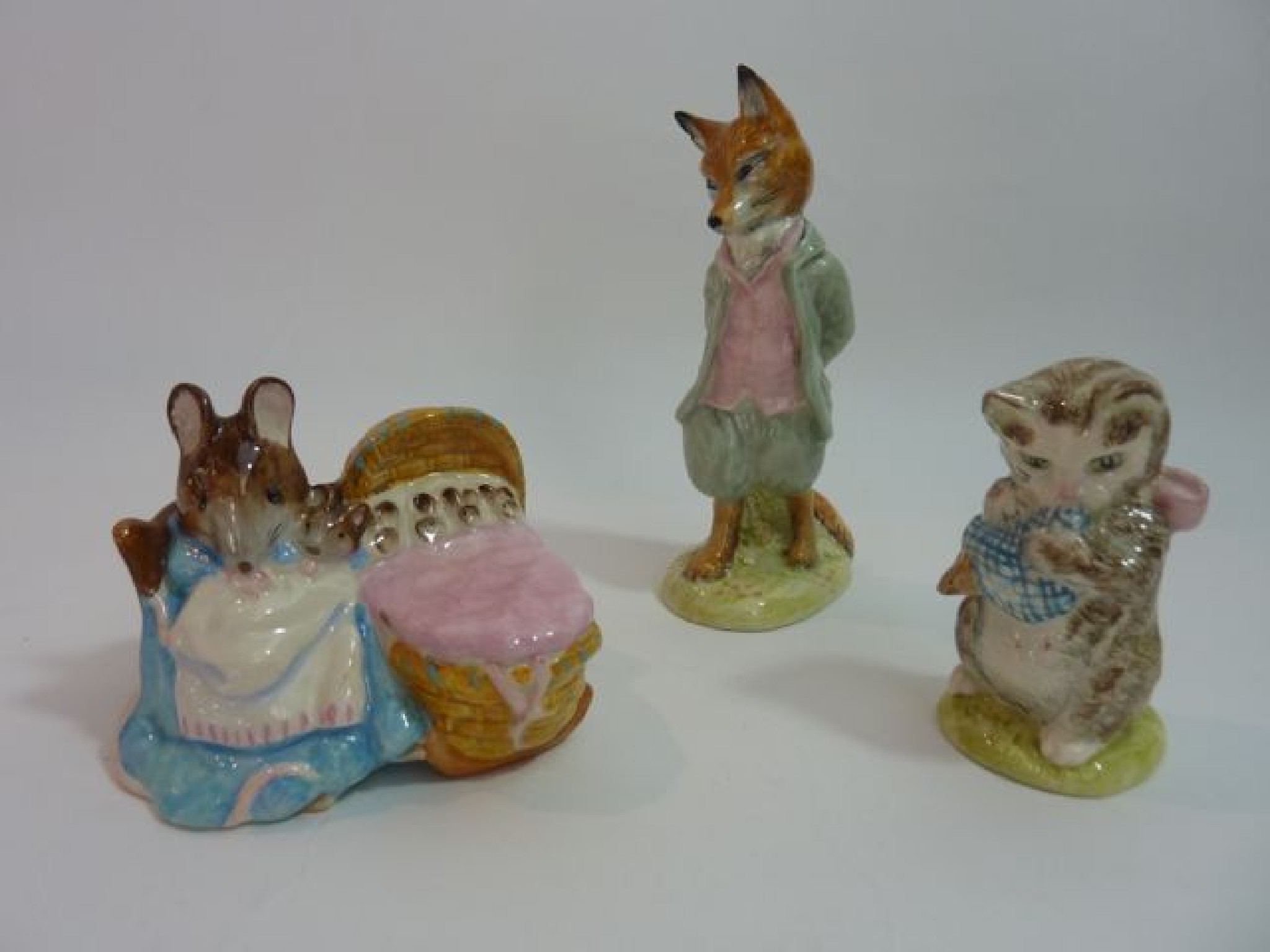 Appraisal: Three Beswick Beatrix Potter figures Hunca Munca Foxy Whiskered Gentleman