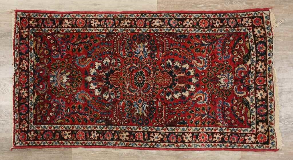 Appraisal: Persian rug Floral motif and fringed edges Tag to one