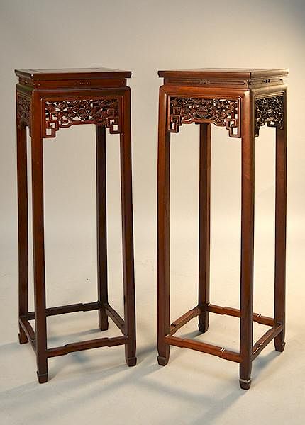 Appraisal: Pair of Chinese carved rosewood tall stands th C Pair