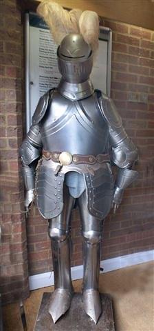 Appraisal: A CROMWELLIAN STYLE STEEL SUIT OF ARMOUR with feathered helmet