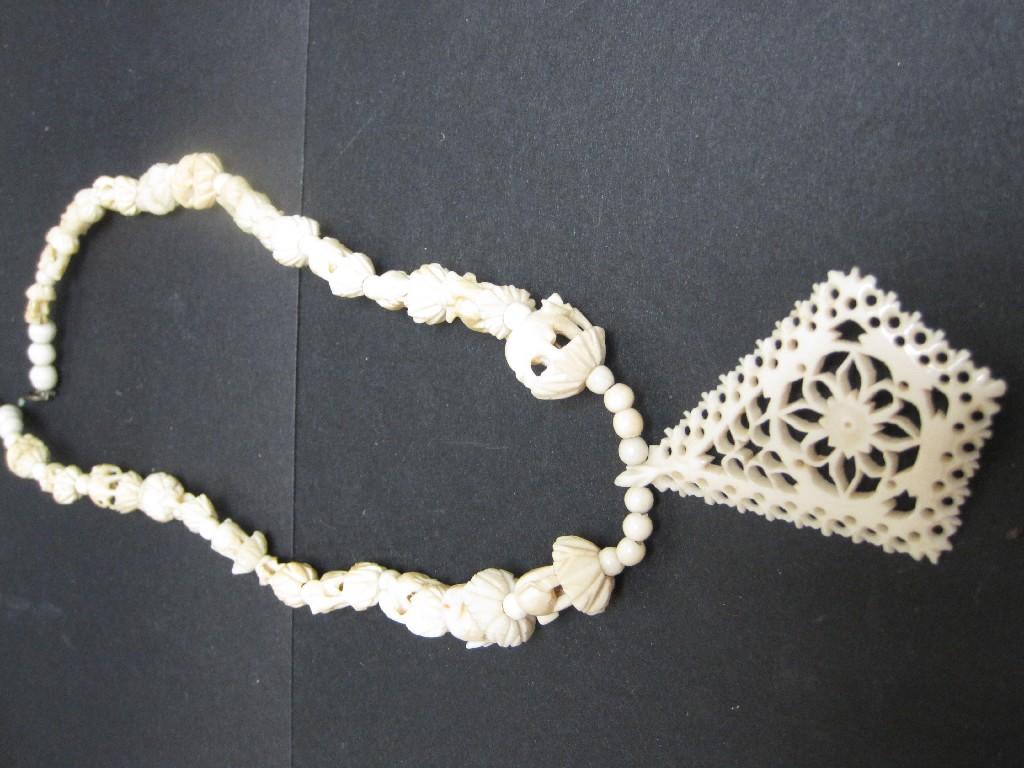 Appraisal: A carved ivory Necklace and lozenge Pendant