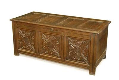 Appraisal: An early th century panelled oak chest the front carved