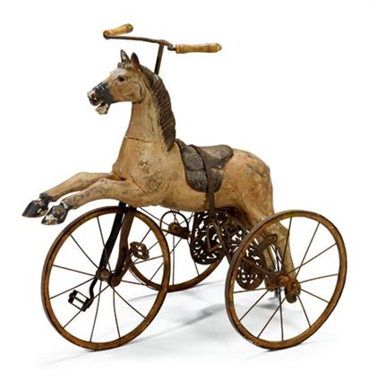 Appraisal: Polychrome wooden horse and iron tricycle th century H in