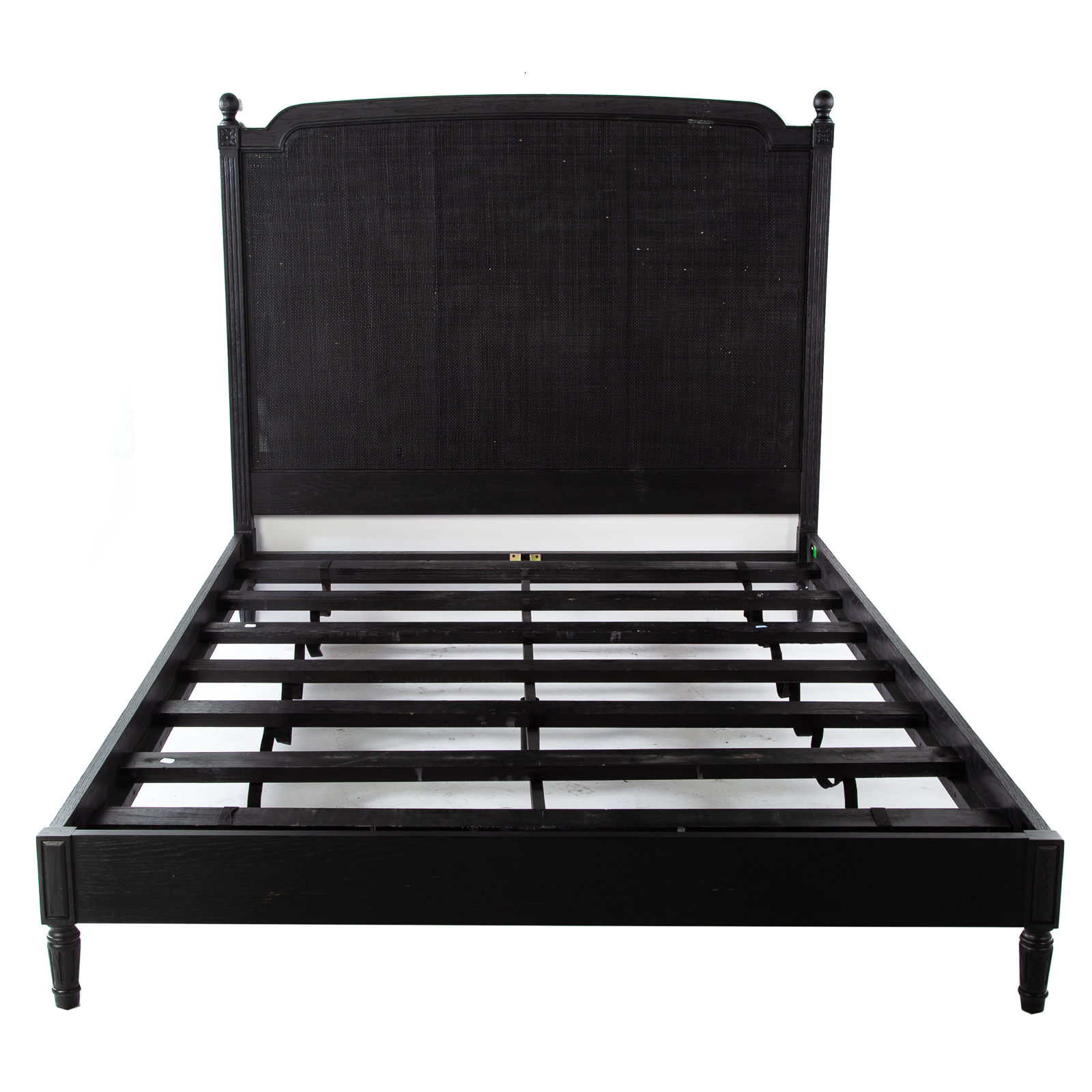 Appraisal: EBONIZED OAK CANED BACK QUEEN-SIZE BED th century with carved