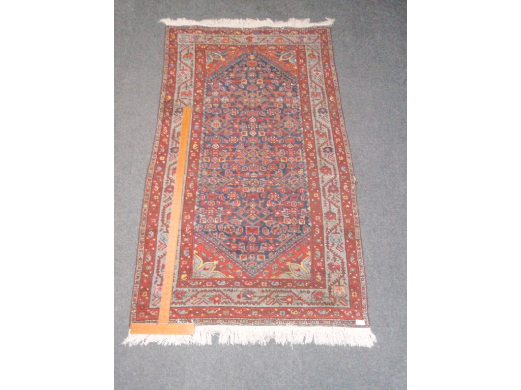 Appraisal: A Turkish design rug with lozenge central field on a