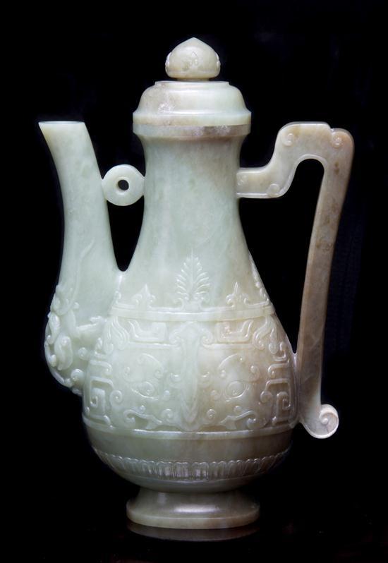 Appraisal: n Archaistic Form Jade Ewer of carved green and brown