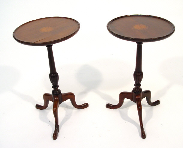 Appraisal: Pair of Edwardian mahogany tripod tables with inlaid tops on