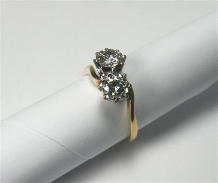 Appraisal: An ct gold mounted two-stone diamond ring of cross-over design