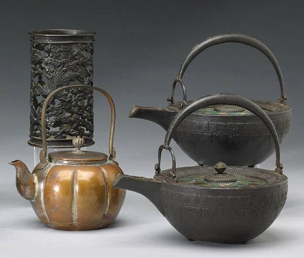 Appraisal: Four metal containers Meiji Period Including a cylindrical reticulated bronze