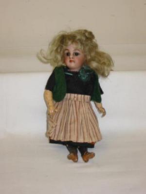 Appraisal: A Kammer Reinhardt bisque head miniature doll with brown fixed