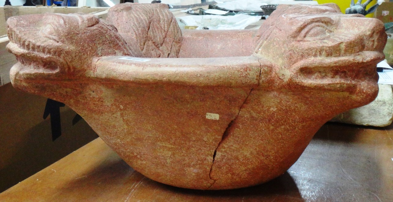 Appraisal: A redstone basin probably Indian the circular rim carved with