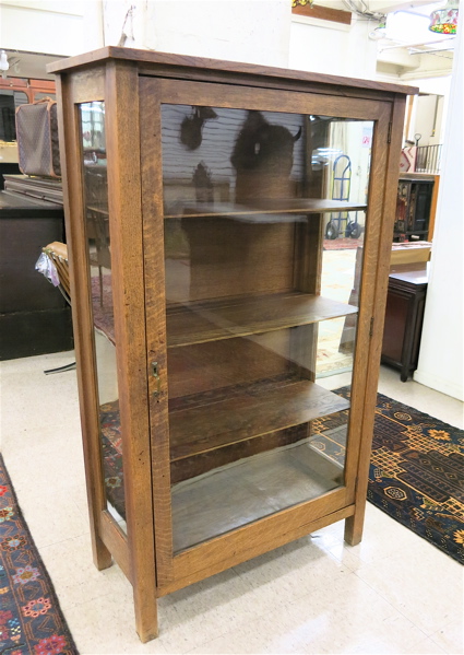 Appraisal: AN OAK AND GLASS CHINA CABINET American c with full-length