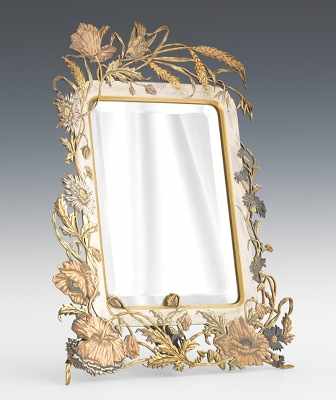 Appraisal: Art Nouveau Mixed Metals Vanity Mirror Classic Art Nouveau border