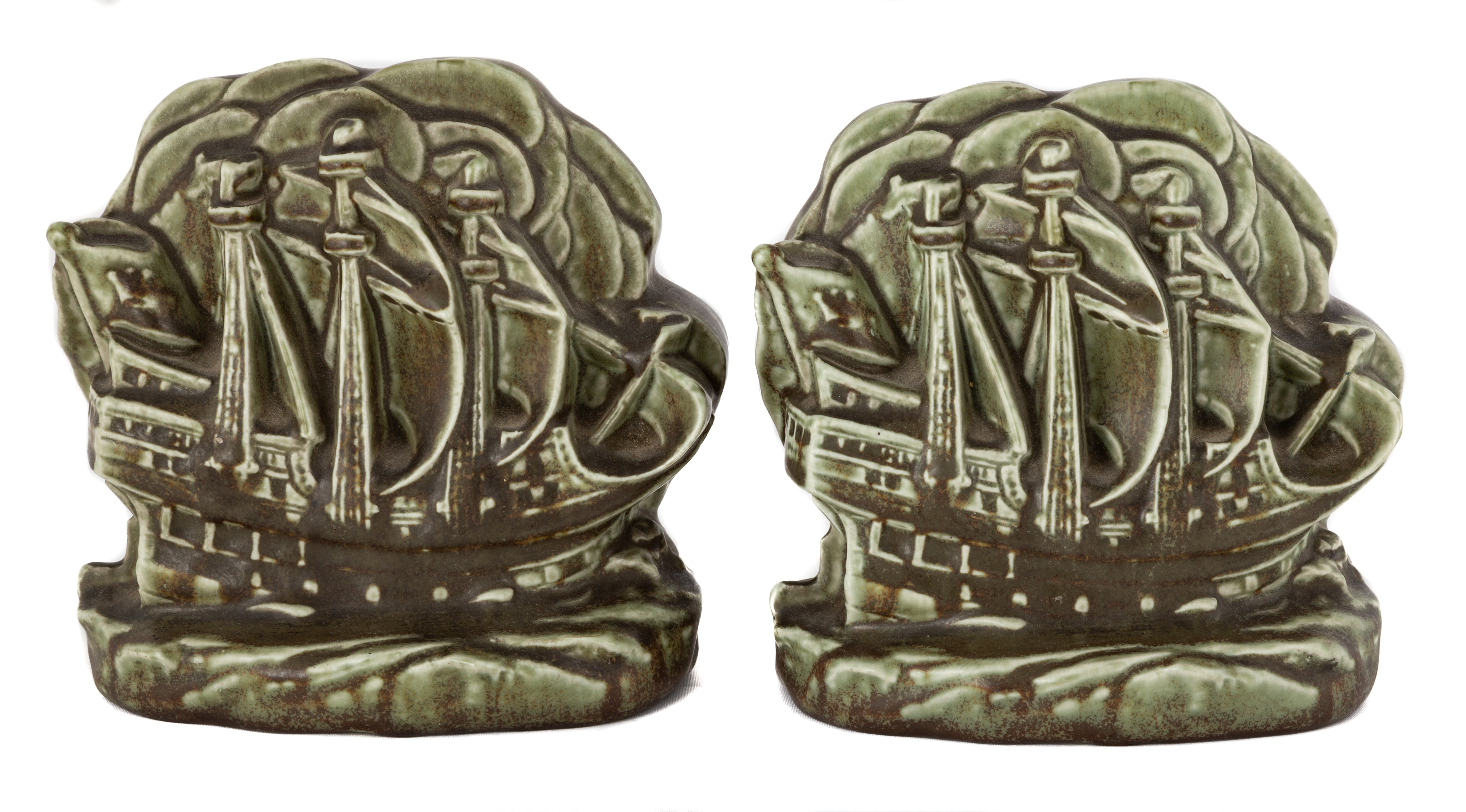 Appraisal: PAIR ROOKWOOD SAILING SHIP BOOKENDS Stamped 'Rookwood'