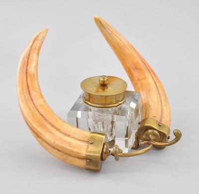 Appraisal: A Heavy Glass Inkwell with Brass Mounts and Boar Tusks