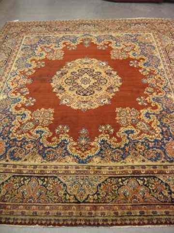 Appraisal: Tabriz Persian Handmade Rug central medallion red field elaborate trim