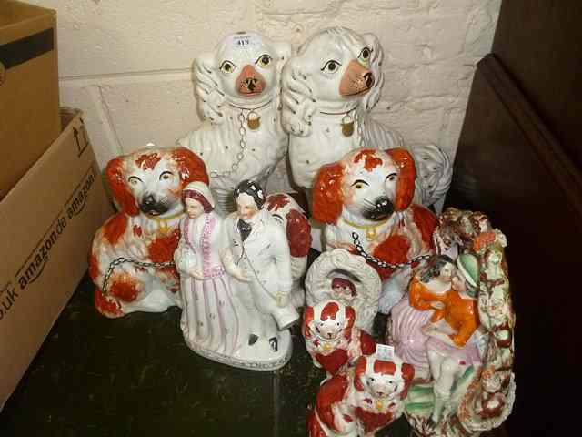 Appraisal: A PAIR OF STAFFORDSHIRE SPANIELS high together with further Staffordshire