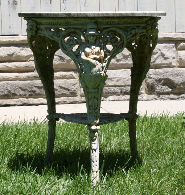 Appraisal: Victorian cast iron garden table embossed metal legs and apron