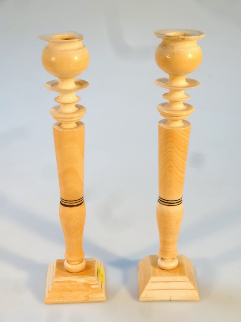 Appraisal: A pair of early thC ivory candlesticks with compressed bellied