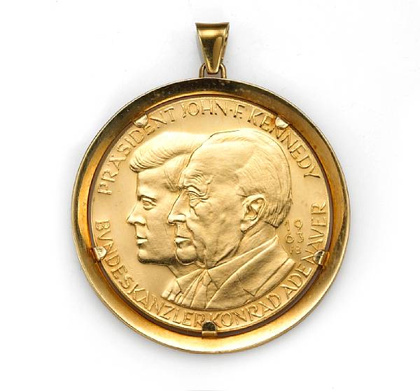 Appraisal: A gold coin pendant featuring a Adenauer-Kennedy gold coin weighing