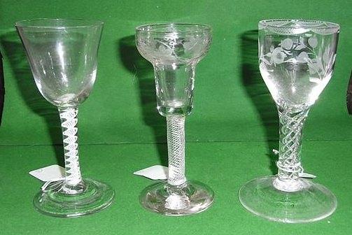 Appraisal: A DRINKING GLASS with air twist stem and etched and