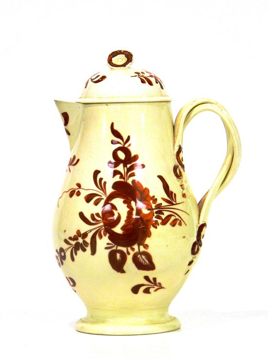 Appraisal: Creamware covered chocolate pot rust floral decoration twist handle ''