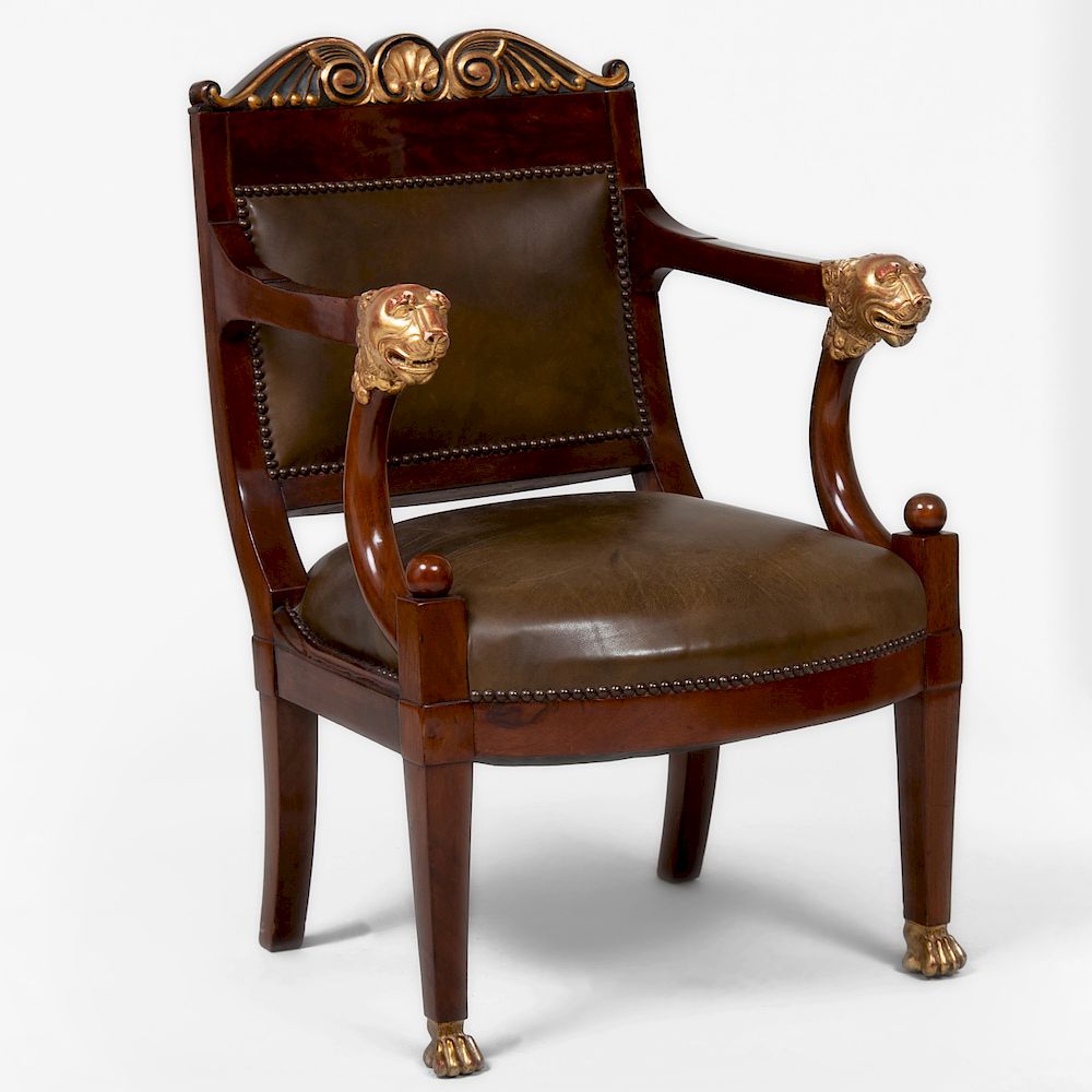 Appraisal: Empire Style Mahogany and Parcel-Gilt Armchair Upholstered in leather Condition