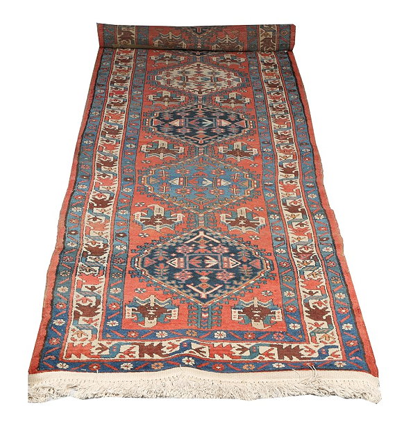 Appraisal: A NORTH WEST PERSIAN ROSE GROUND RUNNER decorated with a