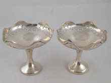 Appraisal: A pair of footed bonbon dishes with scalloped and pierced