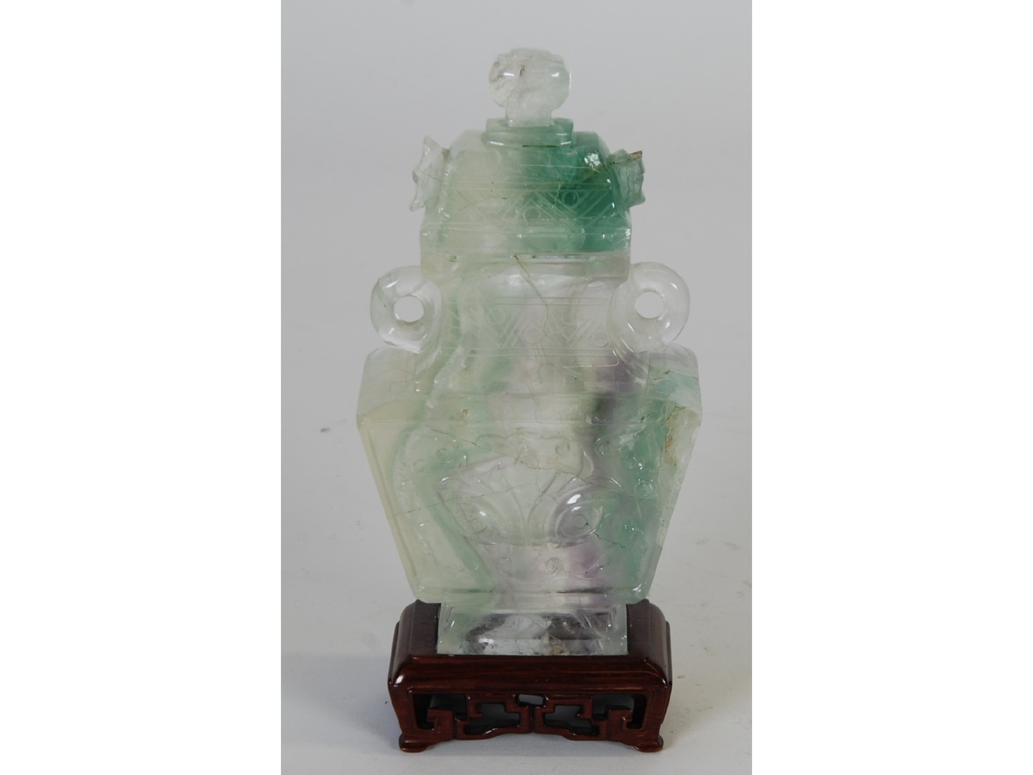 Appraisal: AN ORIENTAL CARVED DYED QUARTZ RECTANGULAR TWO HANDLED VASE AND