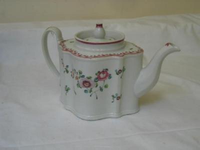 Appraisal: A NEWHALL PORCELAIN SILVER SHAPE TEAPOT and cover painted in