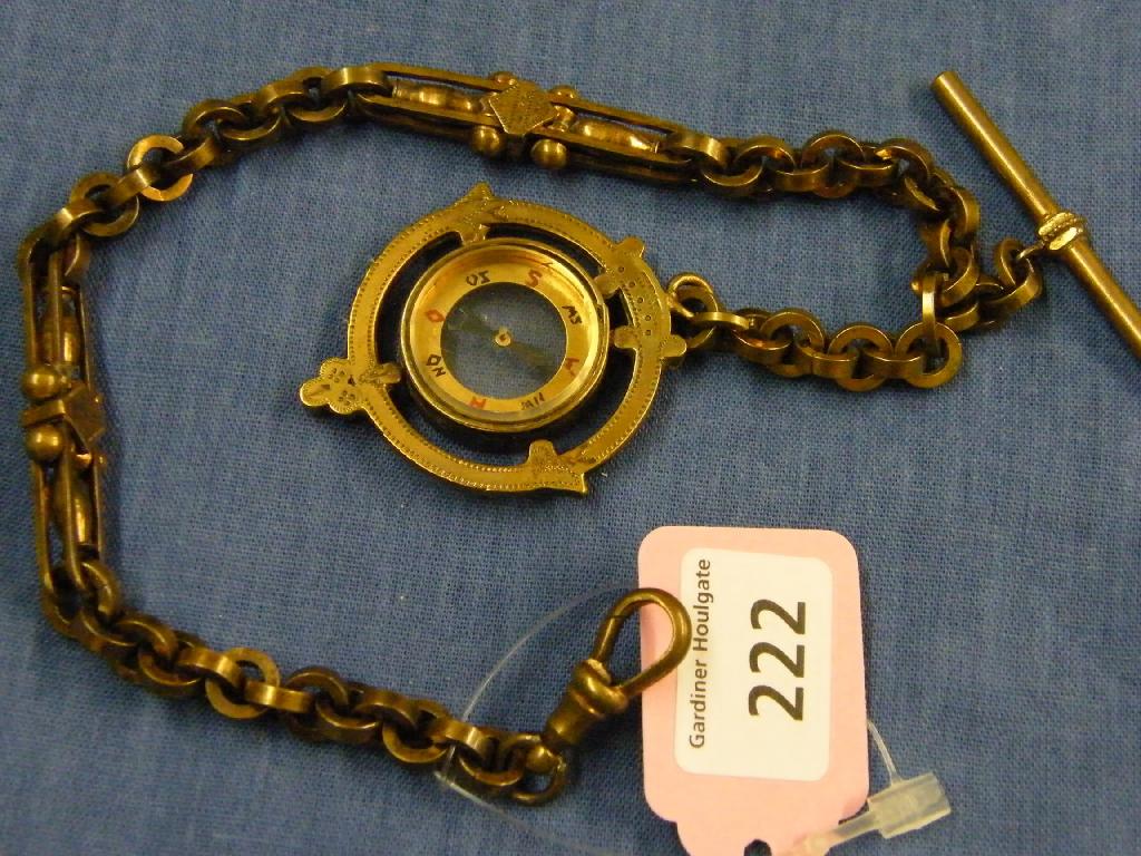 Appraisal: Brass compass pendant on a matching fancy link watch chain