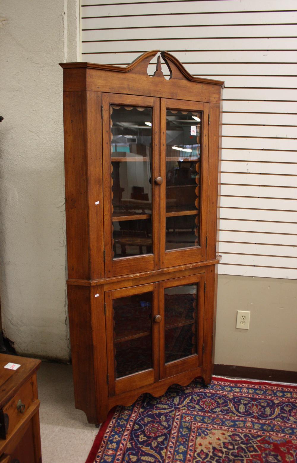 Appraisal: COUNTRY VICTORIAN CORNER CUPBOARD American th century in two stacking