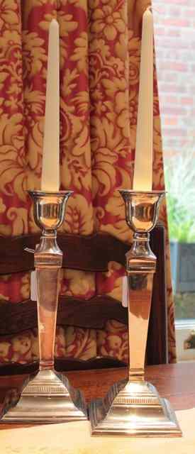 Appraisal: A PAIR OF SILVER PLATED GEORGIAN STYLE CANDLESTICKS with circular