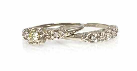 Appraisal: A Pair of Karat White Gold and Diamond Rings containing