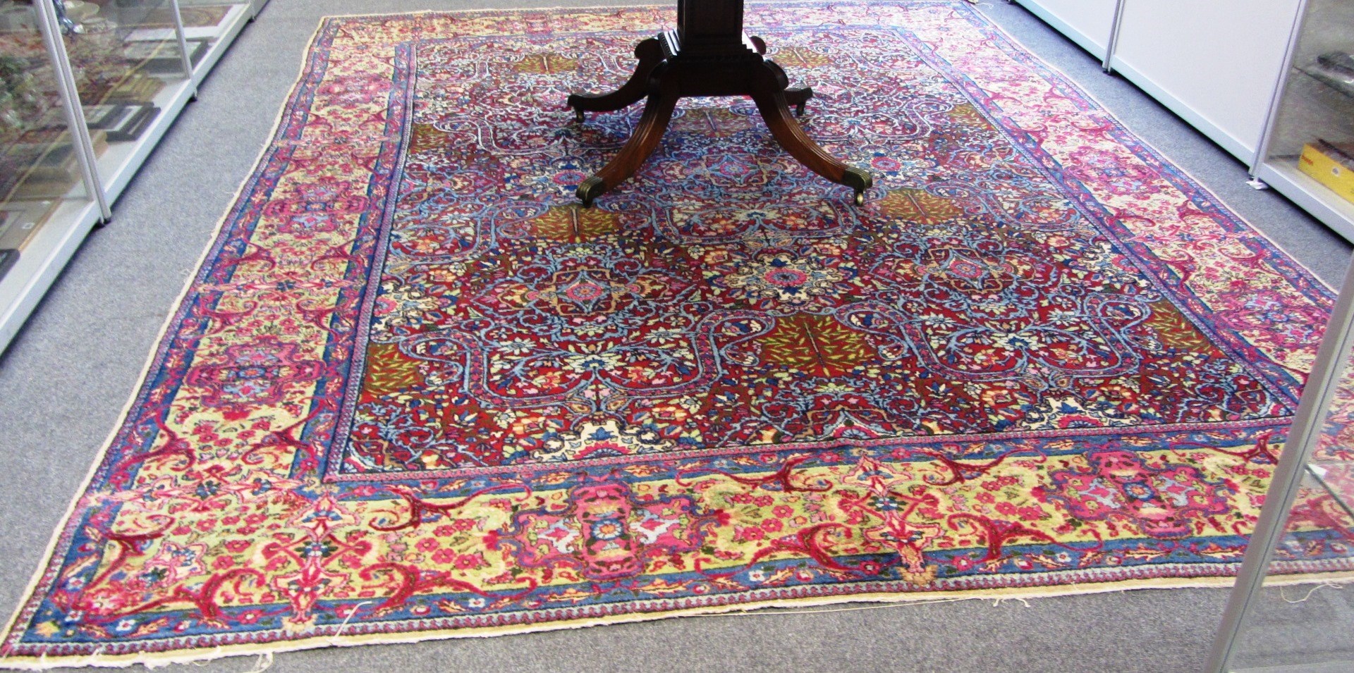 Appraisal: A Kerman carpet Persian the burgundy field with a central