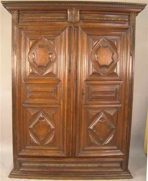 Appraisal: REGENCE WALNUT ARMOIRE th century the dentil-molded cornice over a