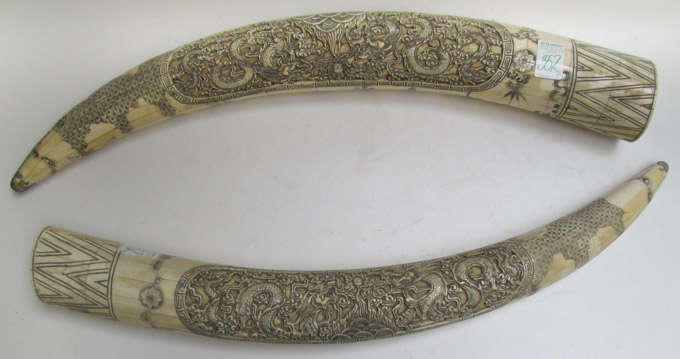 Appraisal: PAIR OF CHINESE CARVED BONE TUSKS scrimshawed decoration and figural