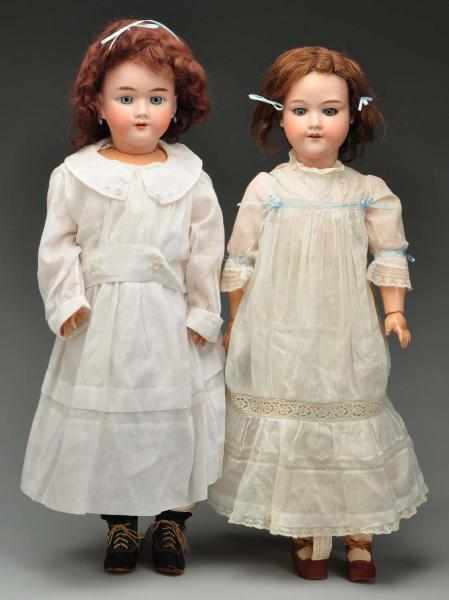 Appraisal: Lot of German Bisque Dolls Description Both with bisque socket