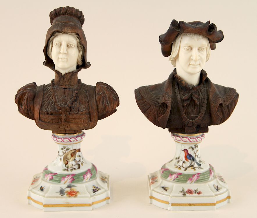 Appraisal: CARVED BONE WOOD FIGURAL BUSTS ON MEISSEN BASES Two carved