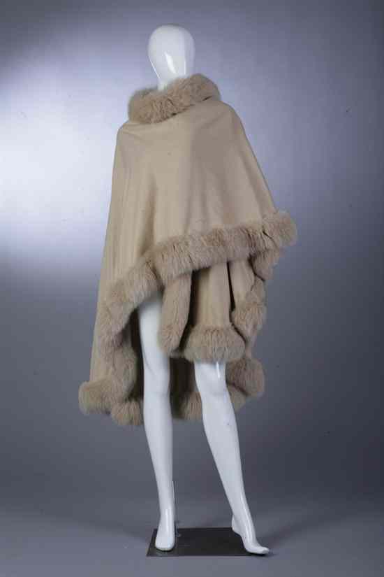 Appraisal: YVES SAINT LAURENT FOURRURES FOX-TRIMMED CASHMERE WRAP Voluminous camel colored