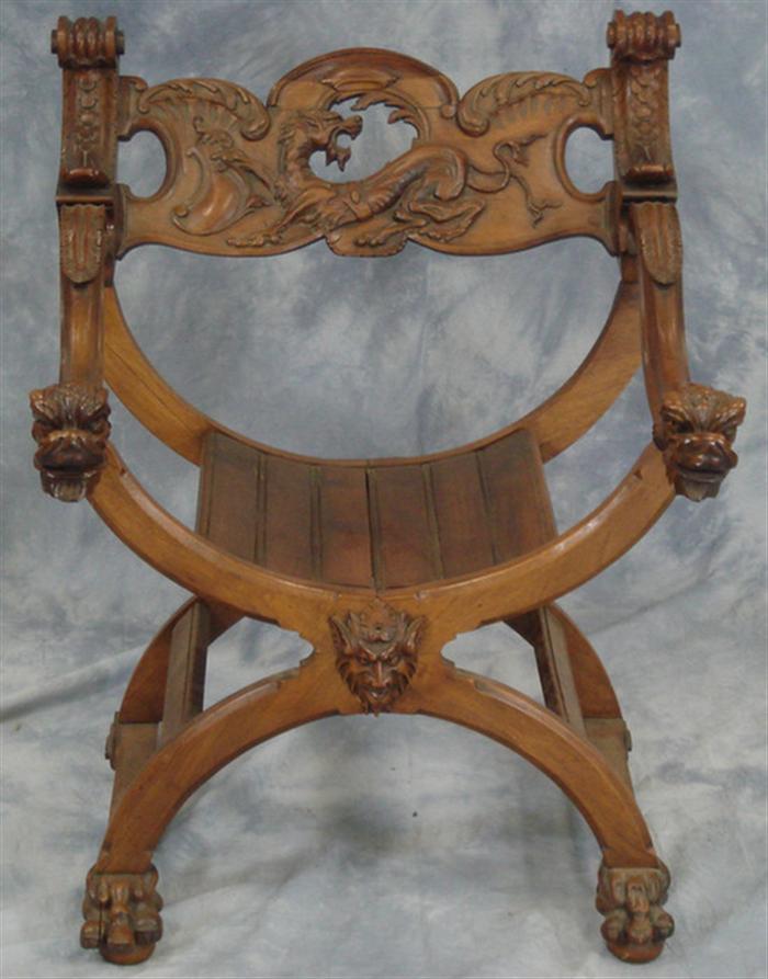 Appraisal: Lion carved mahogany U-chair with full bodied lion carved in