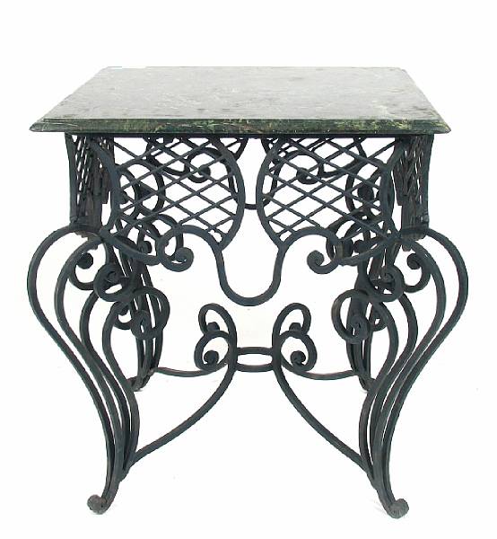 Appraisal: A wrought iron and marble topped center table height in