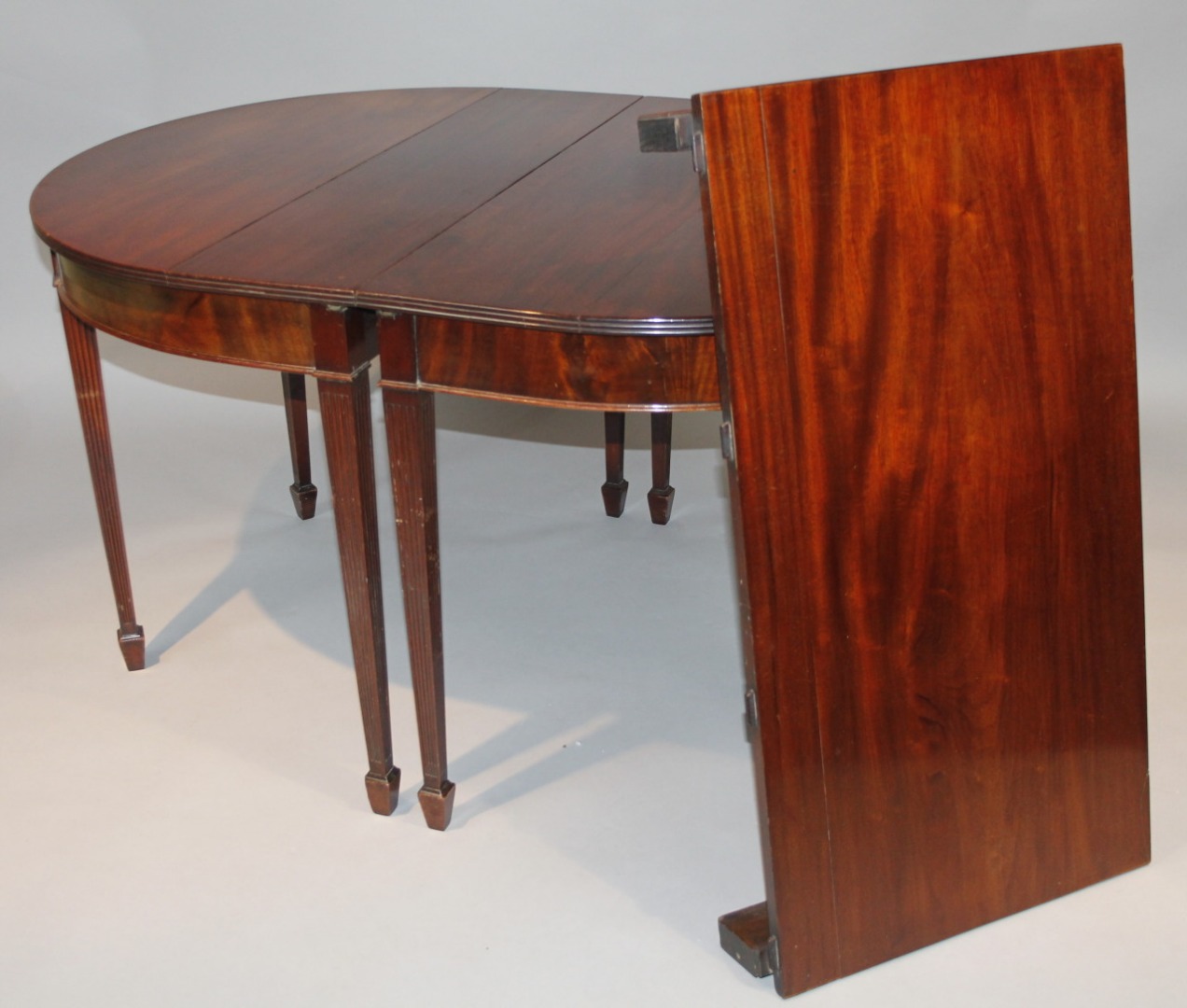 Appraisal: A thC D-end extending dining table the plain top with