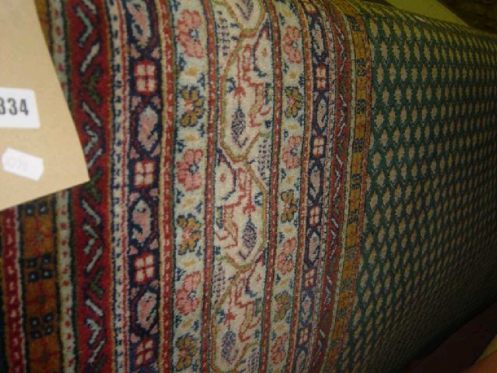 Appraisal: A green ground wool carpet in the Eastern style with