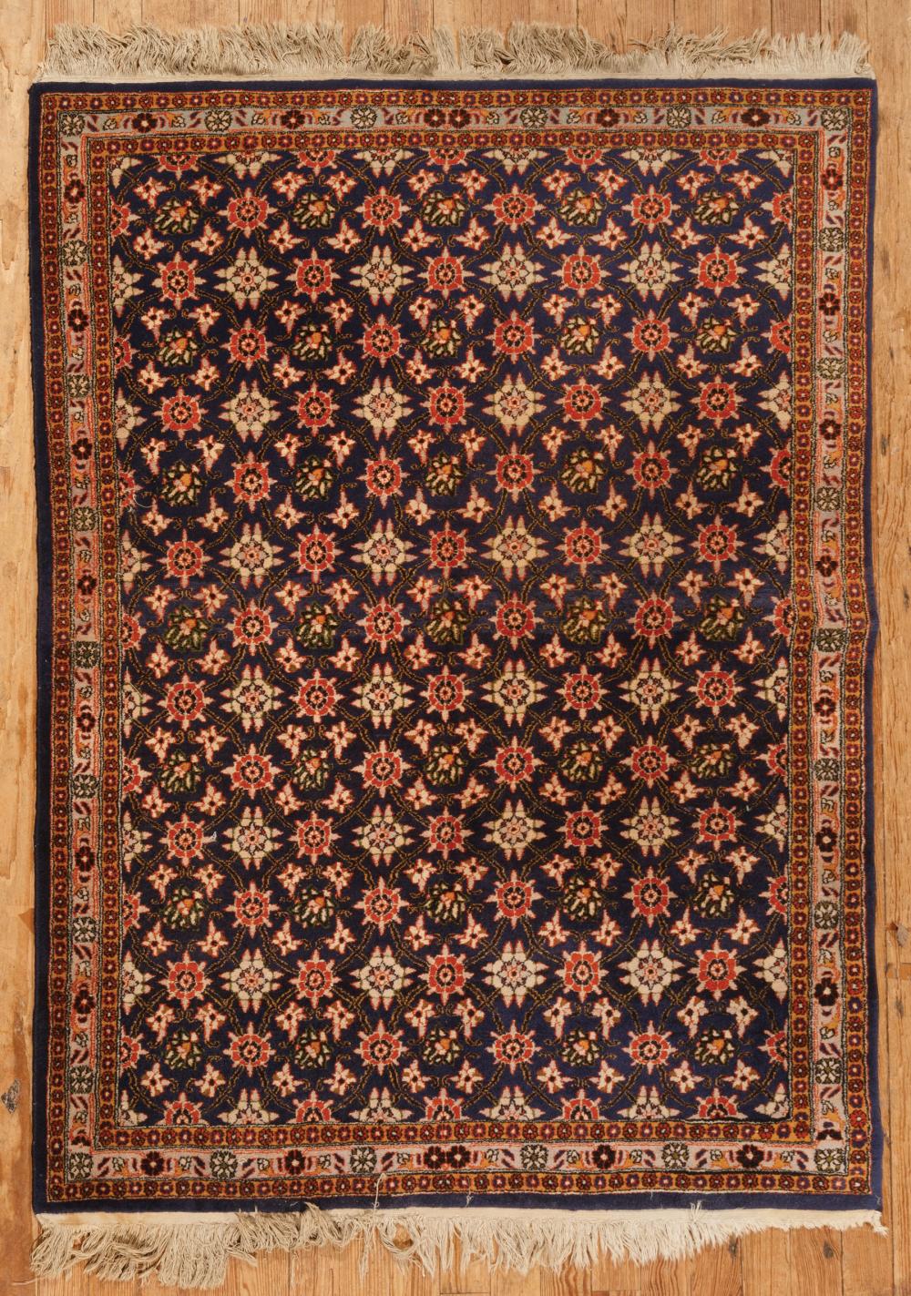 Appraisal: Persian Rug blue ground repeating floral design ft in x