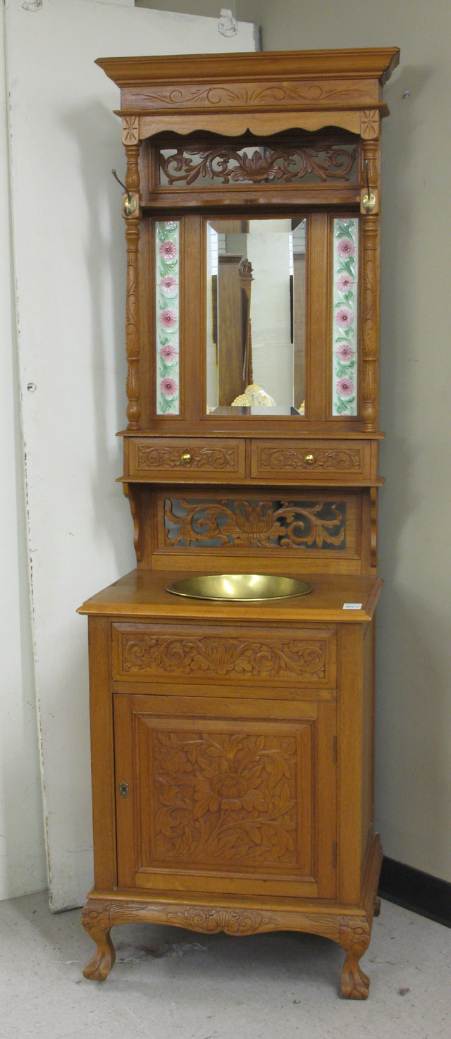 Appraisal: CARVED TEAKWOOD WASHSTAND in two sections base section a single