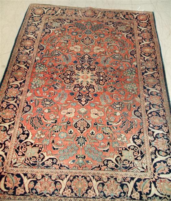 Appraisal: Red ground Persian rug with floral border large central medallion