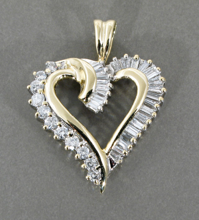 Appraisal: A DIAMOND AND FOURTEEN KARAT OPEN HEART PENDANT faced with